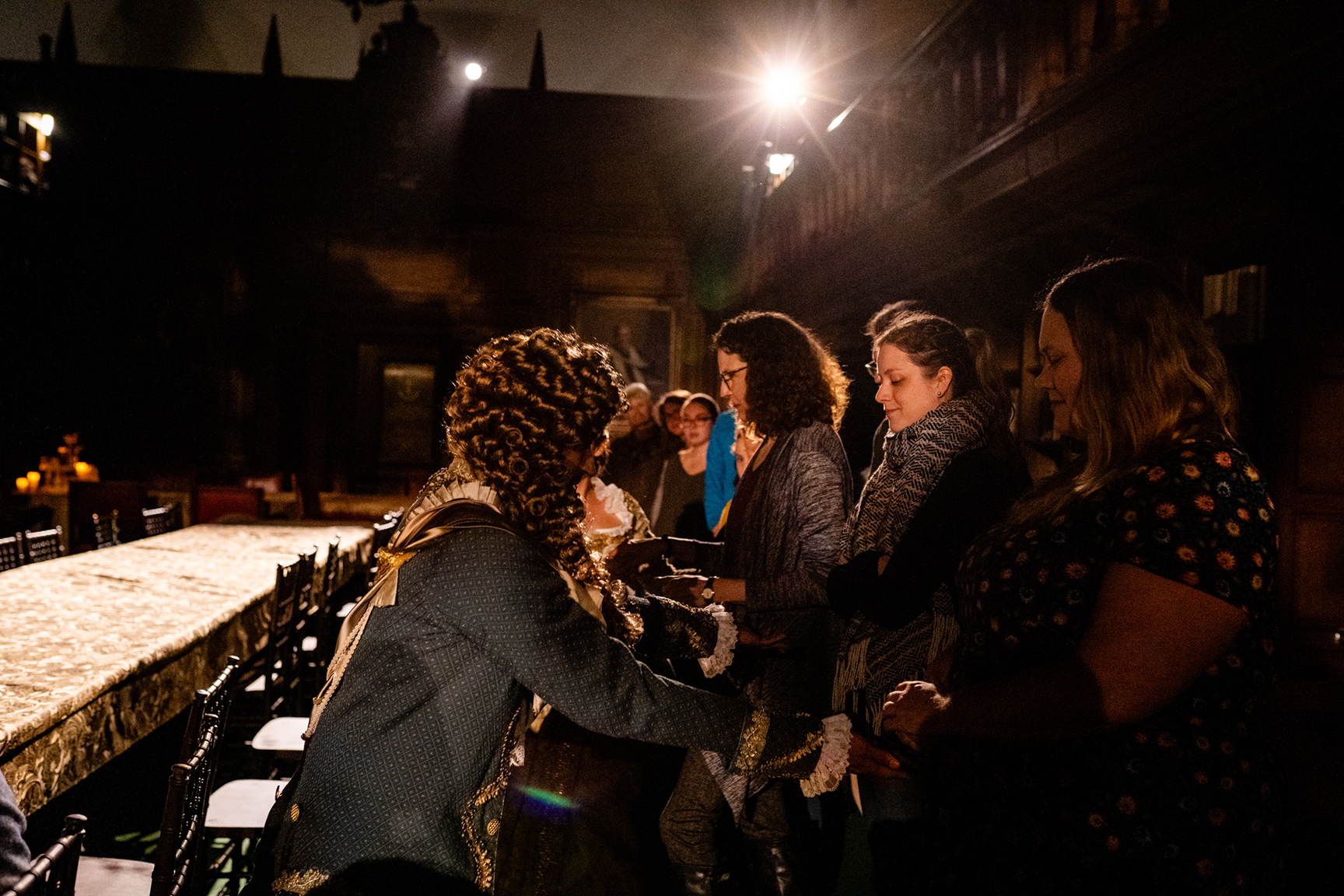 Elisa Tersigni engages with an actor from Third Rail Projects during “Confection,” an interactive performance in the Folger’s Reading Rooms.