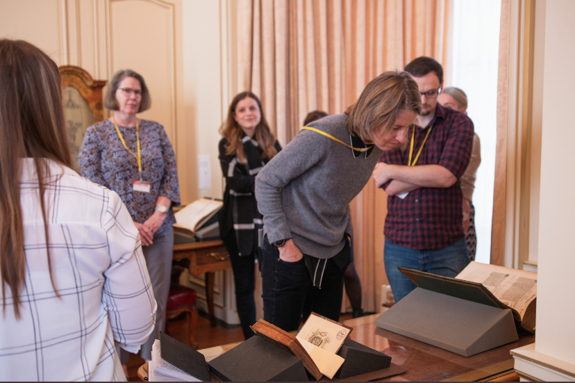 [L to R] Kathleen Lynch, Elisa Tersigni, Heather Wolfe, and Michael Walkden examine books featuring early modern plants on a visit with the Mellon-funded Plant Humanities Initiative at Dumbarton Oaks Research Library and Collection.