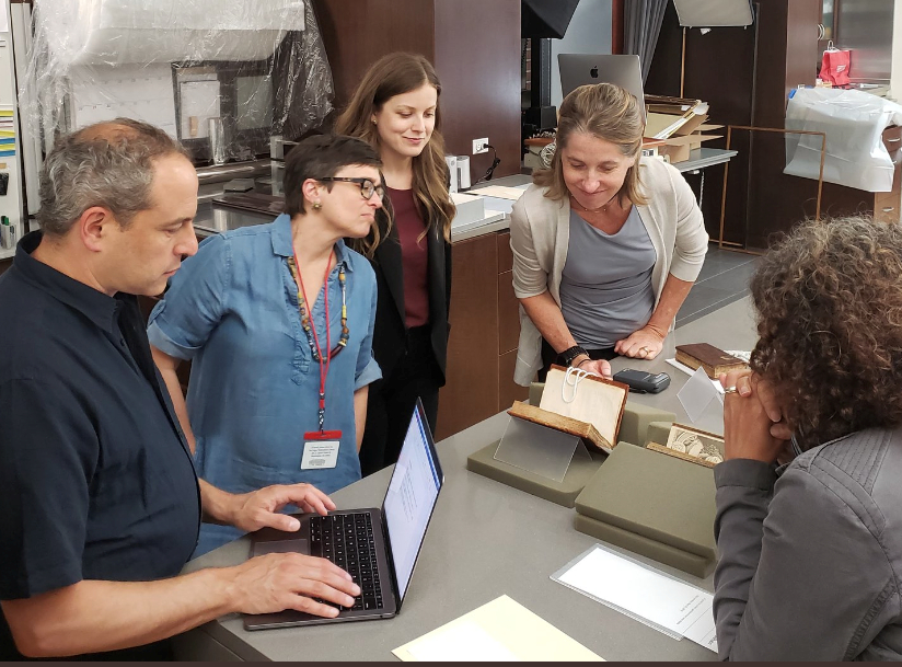 [L to R] David Goldstein, Rebecca LaRoche, Elisa Tersigni, Heather Wolfe, and Caroline Duroselle-Melish discuss early modern author and chef Hannah Woolley in the Folger’s conservation lab.